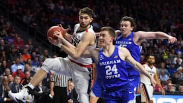 LAS VEGAS, NV - MARCH 06: Killian Tillie #33 of the Gonzaga Bulldogs is fouled as he drives to the basket against McKay Cannon #24 and Payton Dastrup #15 of the Brigham Young Cougars during the championship game of the West Coast Conference basketball tournament at the Orleans Arena on March 6, 2018 in Las Vegas, Nevada. The Bulldogs won 74-54. (Photo by Ethan Miller/Getty Images)