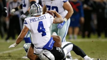 OAKLAND, CA - DECEMBER 17: Khalil Mack #52 of the Oakland Raiders sacks Dak Prescott #4 of the Dallas Cowboys during their NFL game at Oakland-Alameda County Coliseum on December 17, 2017 in Oakland, California. (Photo by Lachlan Cunningham/Getty Images)