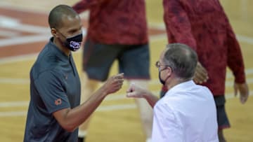 Apr 4, 2020; Austin, TX, USA; Texas Longhorns assistant coach K.T. Turner and Oklahoma Sooners head coach Lon Kruger meet before tip off at the Frank Erwin Center. Mandatory Credit: Ricardo B. Brazziell/American-Statesman via USA TODAY NETWORK