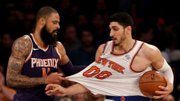 NEW YORK, NY - NOVEMBER 03: Tyson Chandler #4 of the Phoenix Suns pulls at the jersey of Enes Kanter #00 of the New York Knicks at Madison Square Garden on November 3, 2017 in New York City. NOTE TO USER: User expressly acknowledges and agrees that, by downloading and or using this Photograph, user is consenting to the terms and conditions of the Getty Images License Agreement (Photo by Elsa/Getty Images)