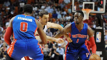 Apr 5, 2016; Miami, FL, USA; Detroit Pistons guard Reggie Jackson (1) looks to get past Miami Heat guard Goran Tragic (center) during the first half of their Tuesday night game at American Airlines Arena. Mandatory Credit: Robert Duyos-USA TODAY Sports
