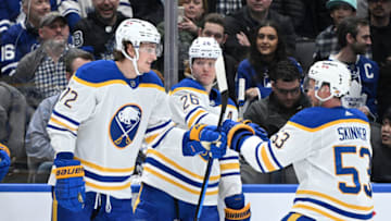 Apr 12, 2022; Toronto, Ontario, CAN; Buffalo Sabres forward Tage Thompson (72) celebrates with defenseman Rasmus Dahlin (26) and forward Jeff Skinner (53) after scoring a goal against the Toronto Maple Leafs in the second period at Scotiabank Arena. Mandatory Credit: Dan Hamilton-USA TODAY Sports