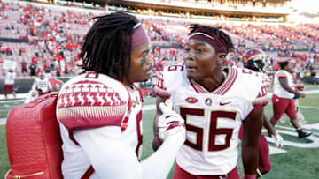 LOUISVILLE, KY - SEPTEMBER 29: Stanford Samuels III #8 and Emmett Rice #56 of the Florida State Seminoles celebrate after the game against the Louisville Cardinals at Cardinal Stadium on September 29, 2018 in Louisville, Kentucky. Florida State came from behind to win 28-24. (Photo by Joe Robbins/Getty Images)