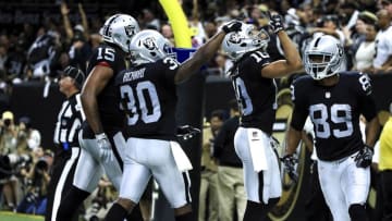 Sep 11, 2016; New Orleans, LA, USA; Oakland Raiders wide receiver Seth Roberts (10) celebrates with teammates after catching a touchdown against the New Orleans Saints during the fourth quarter of a game at the Mercedes-Benz Superdome. The Raiders defeated the Saints 35-34. Mandatory Credit: Derick E. Hingle-USA TODAY Sports