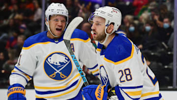 Oct 28, 2021; Anaheim, California, USA; Buffalo Sabres center Zemgus Girgensons (28) celebrates with right wing Kyle Okposo (21) his goal scored against the Anaheim Ducks during the first period at Honda Center. Okposo provided an assist on the goal. Mandatory Credit: Gary A. Vasquez-USA TODAY Sports
