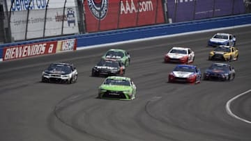 Mar 20, 2016; Fontana, CA, USA; Sprint Cup Series driver Carl Edwards (19) leads during the Auto Club 400 at Auto Club Speedway. Mandatory Credit: Kelvin Kuo-USA TODAY Sports