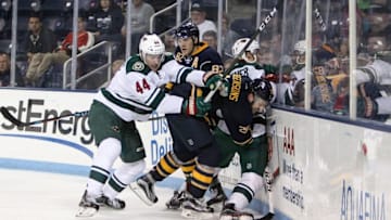 Sep 26, 2016; State College, PA, USA; Buffalo Sabres forward Zemgus Girgensons (28) is checked by Minnesota Wild forward Tyler Graovac (44) during the second period in a preseason hockey game at Pegula Ice Arena. Mandatory Credit: Matthew O