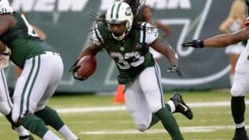 Dec 22, 2013; East Rutherford, NJ, USA; New York Jets running back Chris Ivory runs against the Cleveland Browns during the game at MetLife Stadium. Mandatory Credit: Robert Deutsch-USA TODAY Sports