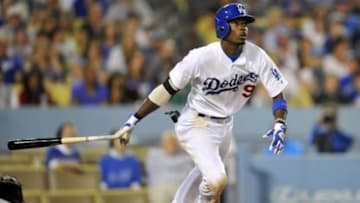September 6, 2014; Los Angeles, CA, USA; Los Angeles Dodgers second baseman Dee Gordon (9) hits an RBI single in the eighth inning against the Arizona Diamondbacks at Dodger Stadium. Mandatory Credit: Gary A. Vasquez-USA TODAY Sports