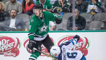 Nov 12, 2015; Dallas, TX, USA; Dallas Stars defenseman Jamie Oleksiak (5) and Winnipeg Jets center Alexander Burmistrov (6) during the game at the American Airlines Center. The Stars defeat the Jets 6-3. Mandatory Credit: Jerome Miron-USA TODAY Sports