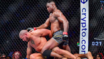 Jan 22, 2022; Anaheim, California, USA; Francis Ngannou (red gloves) competes against Ciryl Gane (blue gloves) during UFC 270 at Honda Center. Mandatory Credit: Gary A. Vasquez-USA TODAY Sports