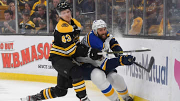 BOSTON, MASSACHUSETTS - JUNE 06: Danton Heinen #43 of the Boston Bruins battles at the boards with Robert Bortuzzo #41 of the St. Louis Blues during the second period of Game Five of the 2019 NHL Stanley Cup Final at TD Garden on June 06, 2019 in Boston, Massachusetts. (Photo by Scott Rovak/NHLI via Getty Images)
