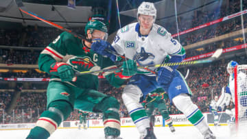 SAINT PAUL, MN - JANUARY 12: Tyler Myers #57 of the Vancouver Canucks defends Mikko Koivu #9 of the Minnesota Wild during the game at the Xcel Energy Center on January 12, 2020 in Saint Paul, Minnesota. (Photo by Bruce Kluckhohn/NHLI via Getty Images)