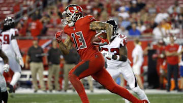 Nov 3, 2016; Tampa, FL, USA; Tampa Bay Buccaneers wide receiver Mike Evans (13) runs with the ball against the Atlanta Falcons during the second half at Raymond James Stadium. Atlanta Falcons defeated the Tampa Bay Buccaneers 43-28. Mandatory Credit: Kim Klement-USA TODAY Sports