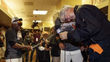 Sept 22, 2012; San Francisco, CA, USA; San Francisco Giants third baseman Pablo Sandoval (left) celebrates with tv announcer Mike Krukow (right) inside the clubhouse after defeating the San Diego Padres 8-4 to clinch the NL West title at AT&T Park. Mandatory Credit: Ben Margot/Pool Photo via USA TODAY Sports