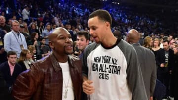 February 15, 2015; New York, NY, USA; Professional boxer Floyd Mayweather (left) and Western Conference guard Stephen Curry of the Golden State Warriors (30, right) during halftime of the 2015 NBA All-Star Game at Madison Square Garden. Mandatory Credit: Bob Donnan-USA TODAY Sports