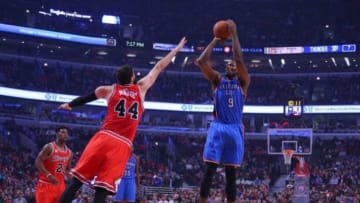 Nov 5, 2015; Chicago, IL, USA;Oklahoma City Thunder forward Serge Ibaka (9) shoots the ball over Chicago Bulls forward Nikola Mirotic (44) during the first quarter at the United Center. Mandatory Credit: Dennis Wierzbicki-USA TODAY Sports