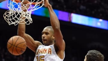 Jan 9, 2016; Atlanta, GA, USA; Atlanta Hawks center Al Horford (15) dunks the ball in front of Chicago Bulls forward Nikola Mirotic (44) during the first half at Philips Arena. Mandatory Credit: Dale Zanine-USA TODAY Sports