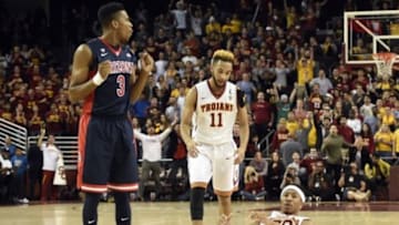 Jan 9, 2016; Los Angeles, CA, USA; Arizona Wildcats guard Justin Simon (3) reacts after he fouls Southern California Trojans guard Elijah Stewart (R) during the fourth overtime period at Galen Center. The Trojans won in the fourth overtime 103-101. Mandatory Credit: Kelvin Kuo-USA TODAY Sports