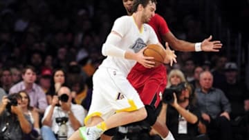 December 25, 2013; Los Angeles, CA, USA; Miami Heat center Chris Bosh (1) defends against Los Angeles Lakers center Pau Gasol (16) during the first half at Staples Center. Mandatory Credit: Gary A. Vasquez-USA TODAY Sports