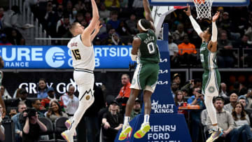 Denver Nuggets center Nikola Jokic (15) shoots the ball over Detroit Pistons center Jalen Duren (0) and Detroit Pistons guard Jaden Ivey (23) Credit: Lon Horwedel-USA TODAY Sports