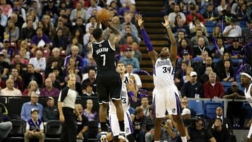Nov 13, 2013; Sacramento, CA, USA; Sacramento Kings power forward Jason Thompson (34) defends the shot by Brooklyn Nets shooting guard Joe Johnson (7) during the third quarter at Sleep Train Arena. The Sacramento Kings defeated the Brooklyn Nets 107-86. Mandatory Credit: Kelley L Cox-USA TODAY Sports