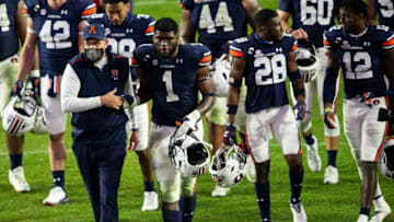 Auburn football head coach Gus Malzahn shake hands with Auburn defensive end Big Kat Bryant (1) after the game at Jordan-Hare Stadium in Auburn, Ala., on Saturday, Nov. 21, 2020. Auburn defeated Tennessee 30-17.