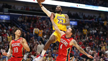 Los Angeles Lakers star LeBron James soars over New Orleans Pelicans guard and Duke basketball legend JJ Redick (Photo by Chris Graythen/Getty Images)