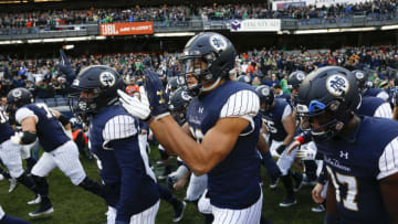 NEW YORK, NY - NOVEMBER 17: Shayne Simon #33 of the Notre Dame Fighting Irish and teammates take the field against the Syracuse Orange during their game at Yankee Stadium on November 17, 2018 in New York, New York. (Photo by Jeff Zelevansky/Getty Images)