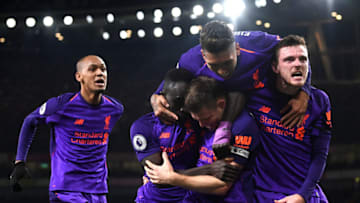 LONDON, ENGLAND - NOVEMBER 03: James Milner of Liverpool celebrates with Sadio Mane, Andy Robertson, Roberto Firmino and Fabinho of Liverpool after he scores his sides first goal during the Premier League match between Arsenal FC and Liverpool FC at Emirates Stadium on November 3, 2018 in London, United Kingdom. (Photo by Michael Regan/Getty Images)