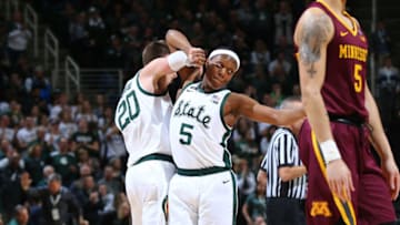 EAST LANSING, MI - FEBRUARY 09: Matt McQuaid #20 of the Michigan State Spartans celebrates his made basket with Cassius Winston #5 of the Michigan State Spartans in the second half at Breslin Center on February 9, 2019 in East Lansing, Michigan. (Photo by Rey Del Rio/Getty Images)