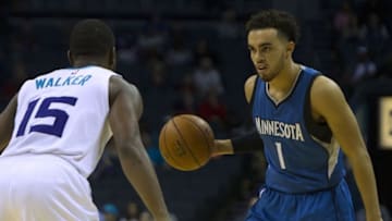 Oct 10, 2016; Charlotte, NC, USA; Minnesota Timberwolves guard Tyus Jones (1) dribbles the ball as Charlotte Hornets guard Kemba Walker (15) defends during the second quarter at Time Warner Cable Arena. The Hornets won 98-86. Mandatory Credit: Joshua S. Kelly-USA TODAY Sports