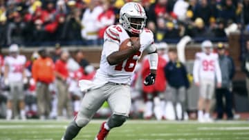 Nov 28, 2015; Ann Arbor, MI, USA; Ohio State Buckeyes quarterback J.T. Barrett (16) runs the ball in the third quarter against the Michigan Wolverines at Michigan Stadium. Mandatory Credit: Tim Fuller-USA TODAY Sports
