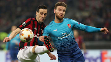 MILAN, ITALY - MARCH 08: Nikola Kalinic of AC Milan competes for the ball with Shkodran Mustafi of Arsenal during UEFA Europa League Round of 16 match between AC Milan and Arsenal at the San Siro on March 8, 2018 in Milan, Italy. (Photo by Marco Luzzani/Getty Images)