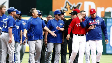 May 15, 2016; Arlington, TX, USA; Toronto Blue Jays manager John Gibbons (5) yells at Texas Rangers manager Jeff Banister (28) after the benches cleared in the eighth inning at Globe Life Park in Arlington. Texas won 7-6. Mandatory Credit: Tim Heitman-USA TODAY Sports