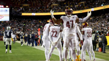 LANDOVER, MARYLAND - JANUARY 08: Linebacker Khaleke Hudson #47 of the Washington Commanders celebrates after the Commanders returned an interception for a touchdown against the Dallas Cowboys at FedExField on January 08, 2023 in Landover, Maryland. (Photo by Rob Carr/Getty Images)