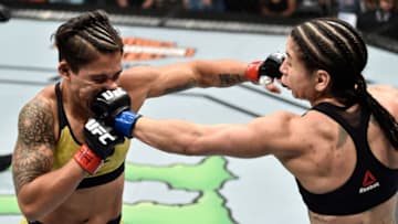 ORLANDO, FL - FEBRUARY 24: (R-L) Tecia Torres punches Jessica Andrade of Brazil in their women's strawweight bout during the UFC Fight Night event at Amway Center on February 24, 2018 in Orlando, Florida. (Photo by Jeff Bottari/Zuffa LLC/Zuffa LLC via Getty Images)