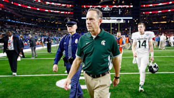 ARLINGTON, TX - DECEMBER 31: Head coach Mark Dantonio walks off the field after losing 38-0 to the Alabama Crimson Tide during the Goodyear Cotton Bowl at AT&T Stadium on December 31, 2015 in Arlington, Texas. (Photo by Scott Halleran/Getty Images)