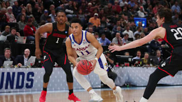 SALT LAKE CITY, UTAH - MARCH 21: Devon Dotson #11 of the Kansas Jayhawks drives to the basket during the first half against the Northeastern Huskies in the first round of the 2019 NCAA Men's Basketball Tournament at Vivint Smart Home Arena on March 21, 2019 in Salt Lake City, Utah. (Photo by Tom Pennington/Getty Images)