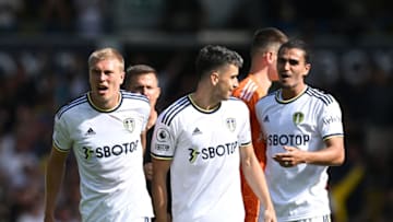 Rasmus Kristensen, Marc Roca and Pascal Struijk celebrate at the end of the English Premier League football match between Leeds United and Chelsea at Elland Road in Leeds, northern England, on August 21, 2022. (Photo by PAUL ELLIS/AFP via Getty Images)