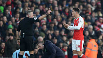 LONDON, ENGLAND - JANUARY 22: Granit Xhaka (R) of Arsenal protests to referee Jonathan Moss after shown a red card during the Premier League match between Arsenal and Burnley at the Emirates Stadium on January 22, 2017 in London, England. (Photo by Shaun Botterill/Getty Images)