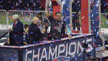 HOUSTON, TX - FEBRUARY 05: Tom Brady #12 of the New England Patriots raises the Vince Lombardi trophy after the Patriots defeat the Atlanta Falcons 34-28 in overtime of Super Bowl 51 at NRG Stadium on February 5, 2017 in Houston, Texas. (Photo by Focus on Sport/Getty Images)