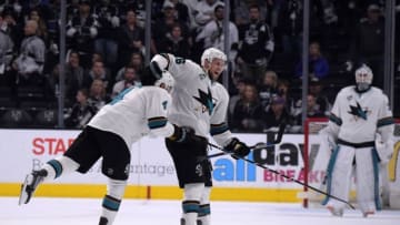 Apr 22, 2016; Los Angeles, CA, USA; San Jose Sharks center Nick Spaling (16) and defenseman Brenden Dillon (4) celebrate at the end of game five of the first round of the 2016 Stanley Cup Playoffs against the Los Angeles Kings at Staples Center. The Sharks defeated the Kings 6-3 to win the series 4-1. Mandatory Credit: Kirby Lee-USA TODAY Sports