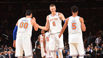 NEW YORK,NY - DECEMBER 6 : Enes Kanter #00, Courtney Lee #5 and Kristaps Porzingis #6 of the New York Knicks react after the win against the Memphis Grizzlies at Madison Square Garden on December 6, 2017 in New York, New York. Copyright 2017 NBAE (Photo by Jesse D. Garrabrant/NBAE via Getty Images)