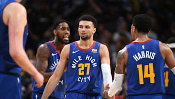 DENVER, CO - APRIL 13: Jamal Murray #27 and Gary Harris #14 of the Denver Nuggets high five during Game One of Round One of the 2019 NBA Playoffs against the San Antonio Spurs on April 13, 2019 at the Pepsi Center in Denver, Colorado. NOTE TO USER: User expressly acknowledges and agrees that, by downloading and/or using this photograph, user is consenting to the terms and conditions of the Getty Images License Agreement. Mandatory Copyright Notice: Copyright 2019 NBAE (Photo by Garrett Ellwood/NBAE via Getty Images)