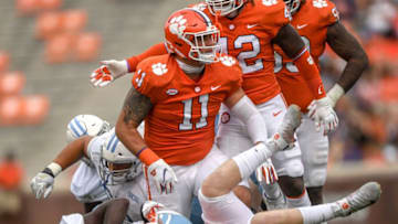Clemson defensive lineman Bryan Bresee(11) stands up after helping linebacker Jake Venables(15) tackle The Citadel sophomore Emeka Nwanze(32) during the second quarter of the game Saturday, Sept. 19, 2020 at Memorial Stadium in Clemson, S.C.Clemson The Citadel Ncaa Football