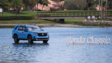 A "floating" 2023 Honda Pilot is seen next to the Honda Classic logo in the waters close to the 18th hole during the second round of the Honda Classic at PGA National Resort & Spa on Friday, February 24, 2023, in Palm Beach Gardens, FL.