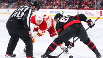 OTTAWA, CANADA - FEBRUARY 13: Derick Brassard #61 of the Ottawa Senators wins a faceoff against Mikael Backlund #11 of the Calgary Flames at Canadian Tire Centre on February 13, 2023 in Ottawa, Ontario, Canada. (Photo by Chris Tanouye/Freestyle Photography/Getty Images)