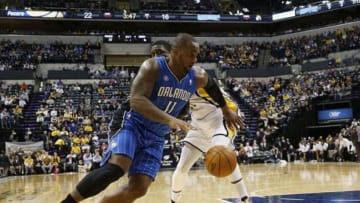 Feb 3, 2014; Indianapolis, IN, USA; Orlando Magic center Glen Davis (11) drives to the basket against Indiana Pacers center Roy Hibbert (55) at Bankers Life Fieldhouse. Mandatory Credit: Brian Spurlock-USA TODAY Sports