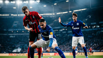 GELSENKIRCHEN, GERMANY - DECEMBER 21: (EDITORS NOTE: Image has been digitally enhanced) Nils Petersen of Freiburg in action against Omar Mascarell of Schalke 04 during the Bundesliga match between FC Schalke 04 and Sport-Club Freiburg at Veltins-Arena on December 21, 2019 in Gelsenkirchen, Germany. (Photo by Alexander Scheuber/Bundesliga/Bundesliga Collection via Getty Images)